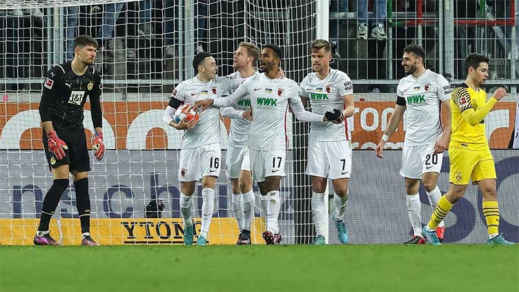 Dortmund held at Augbsurg to leave Bayern eight points clear