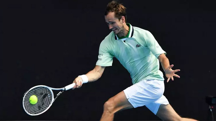 Medvedev gets crowd onside to reach last 16 for fourth year