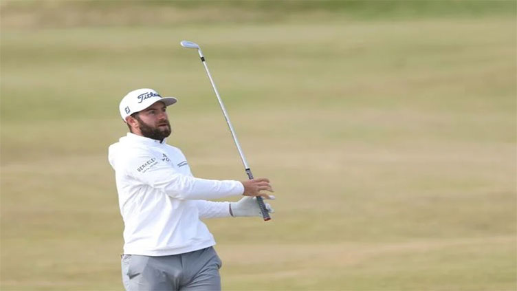 Young leads from McIlroy at British Open but woe for Woods