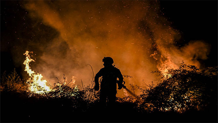 Wildfires blaze across sweltering southwest Europe