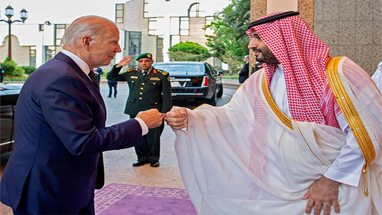 Biden fist-bumps Saudi crown prince, then raises attacks on dissidents