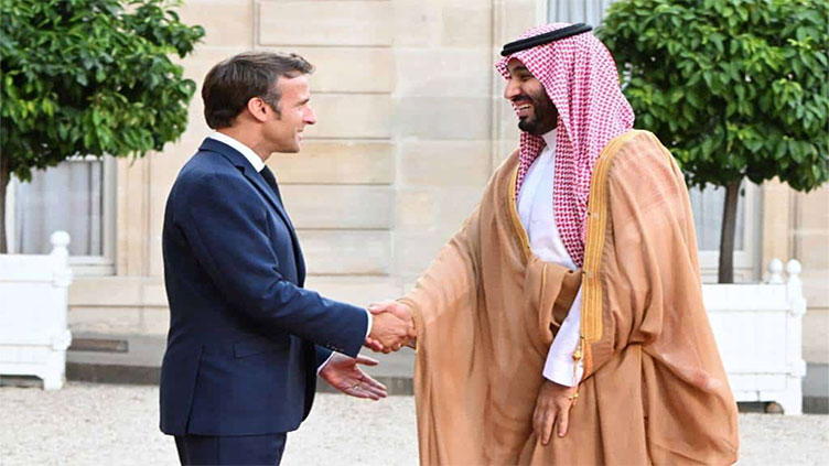Macron defies anger to welcome Saudi strongman
