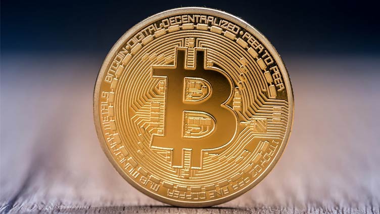 Bitcoin slumps under $25,000, lowest in 18 months