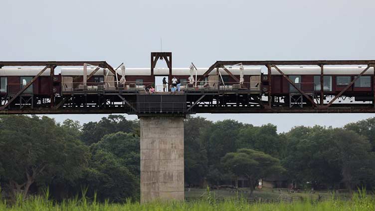 Suspended over a wildlife river, South African hotel train defies lockdown odds