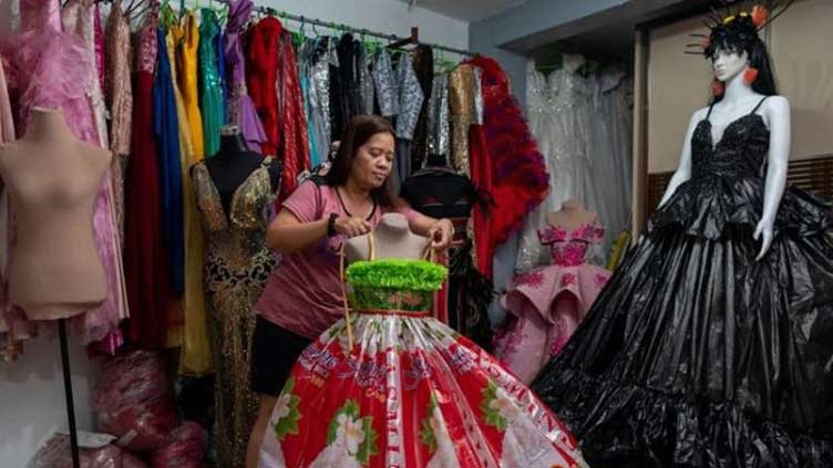 Philippine designer fashions gowns out of recycled trash