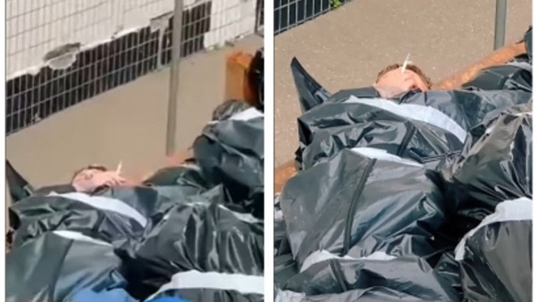 Video of man smoking among body bags is from a 2020 music video