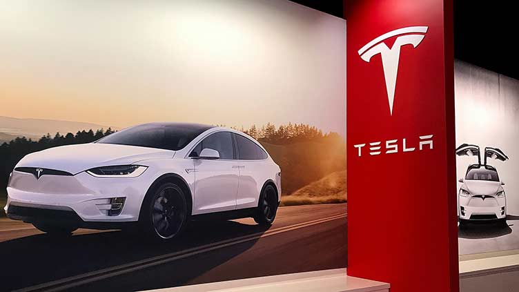 Tesla says it is trying to keep production going at Shanghai factory