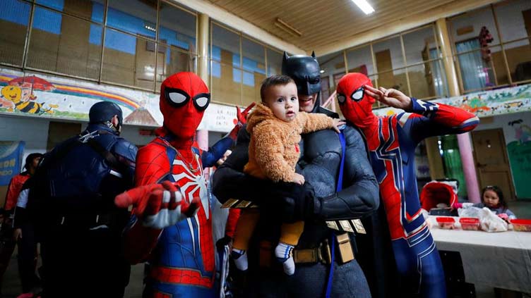 Batman, Princess Elsa and other superheroes visit Argentine prison