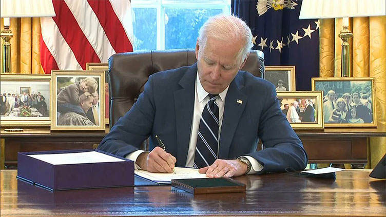 Biden signs measure speeding up US weapons deliveries to Ukraine