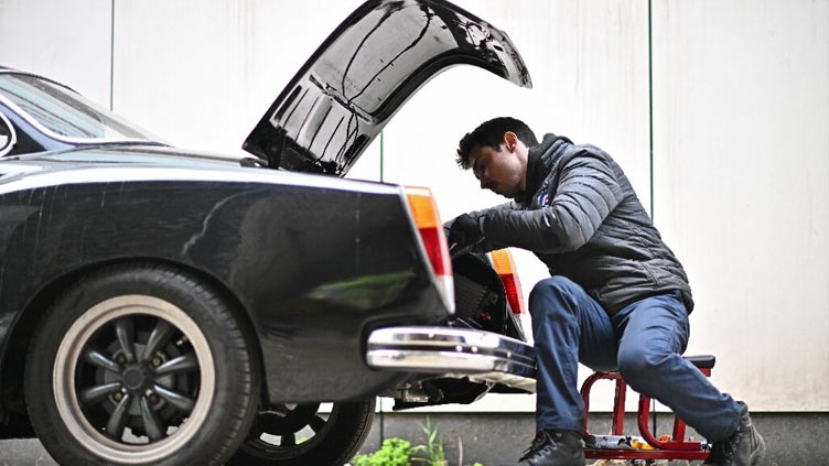 Cars swapping vroom for volts in London garage