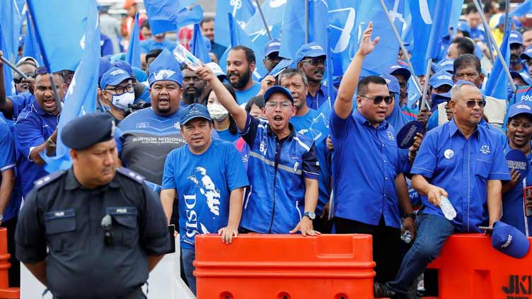 Malaysian leaders kick off election campaigns in tight race