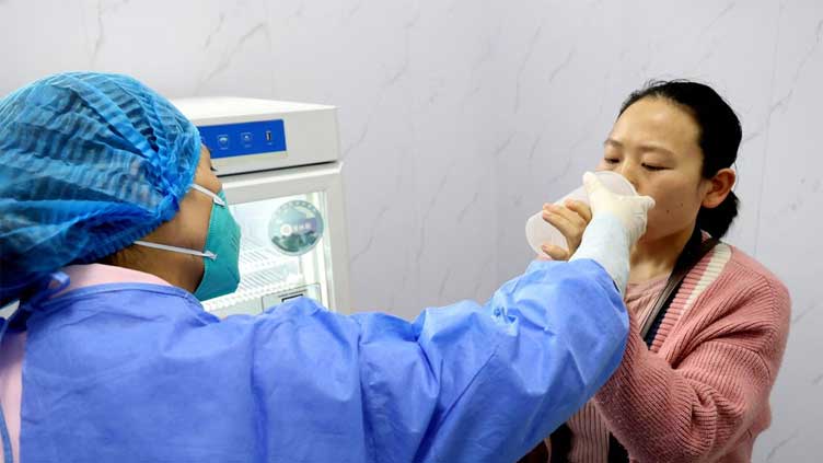  China posts 6-month high COVID count as it sticks with strategy