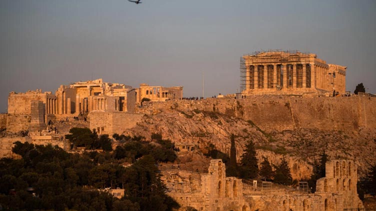 Greece's treasures caught between tourism and conservation