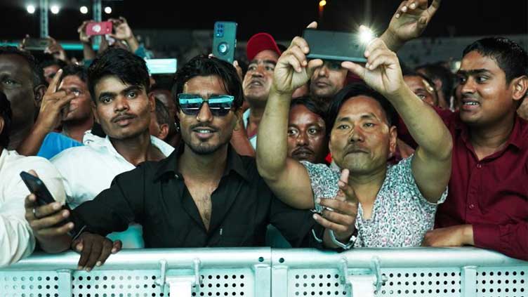  On outskirts of Doha, laborers watch World Cup they built