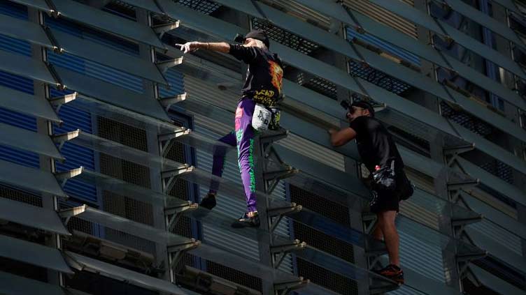  'French Spiderman' climbs first skyscraper with son in Barcelona