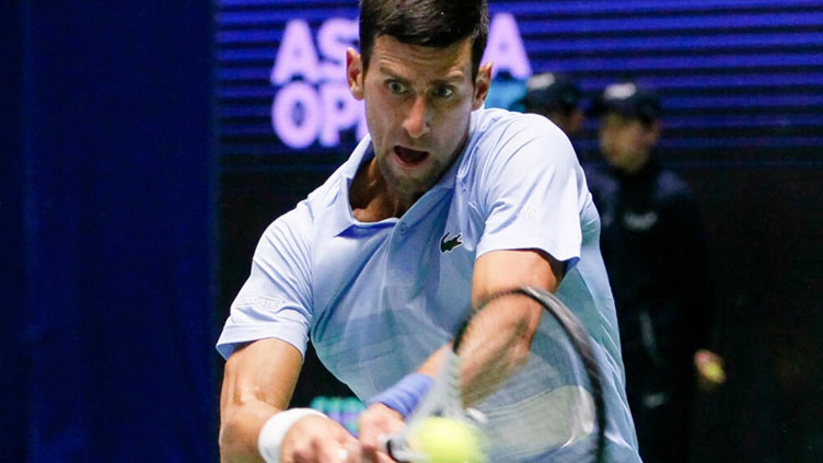 Djokovic into Astana final after surprise Medvedev retirement