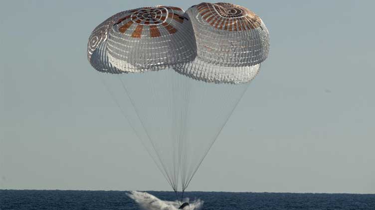  SpaceX ferries astronauts back to Earth after half-year away