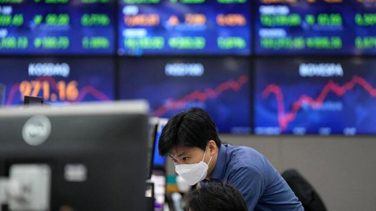 Asia shares slip, testing times for UK bonds