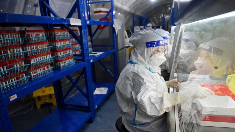  On COVID alert, more Chinese cities advise residents to stay put for holiday