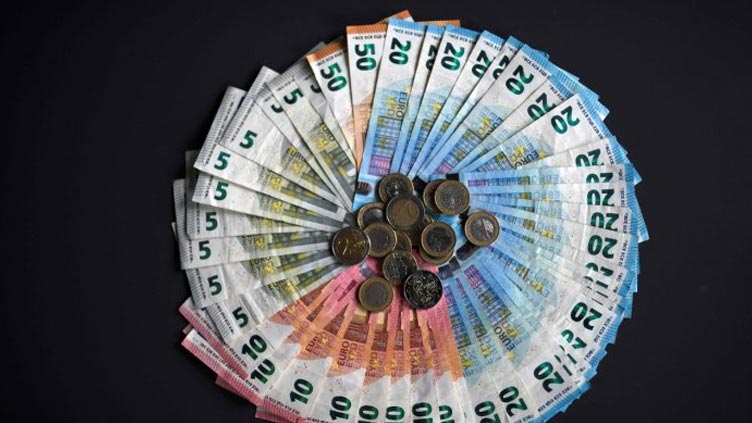 Euro surges as ECB seen hiking interest rates further