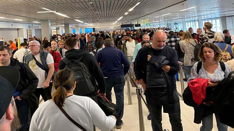 Amsterdam's overcrowded airport to cut passenger flows