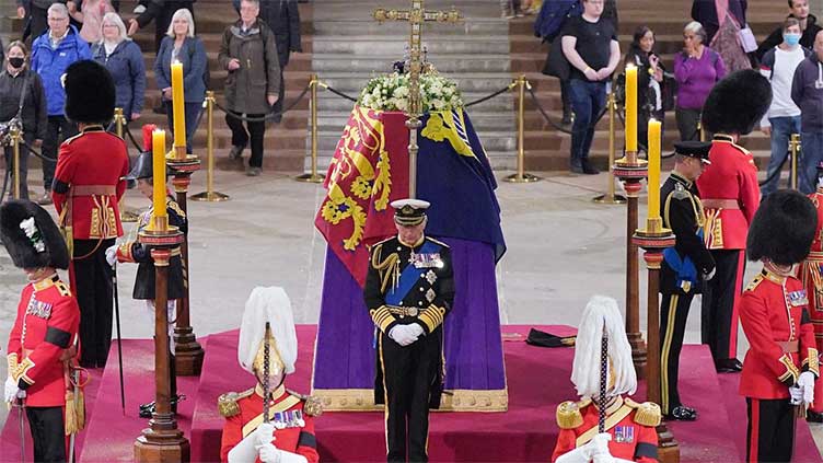 Queen Elizabeth's children guard coffin in solemn vigil