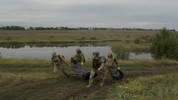  Near the Russian border, bodies still lie on the battlefield