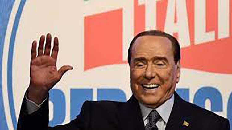 Italy's 'immortal' Berlusconi returns, seeking fatherly role