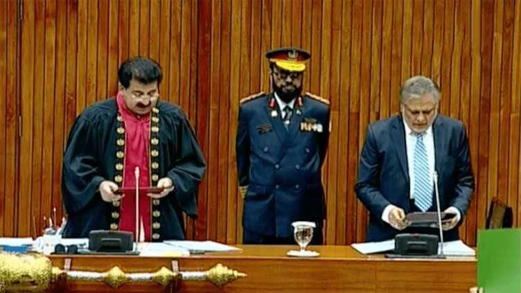 Ishaq Dar takes oath as senator amid opposition protest