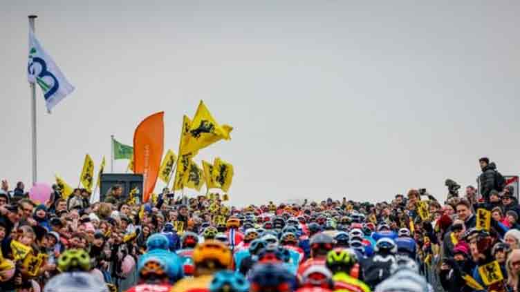 Mass fall as 40 riders hit the tarmac at Tour of Flanders