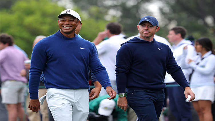 Woods and McIlroy fly PGA Tour flag at Masters practice