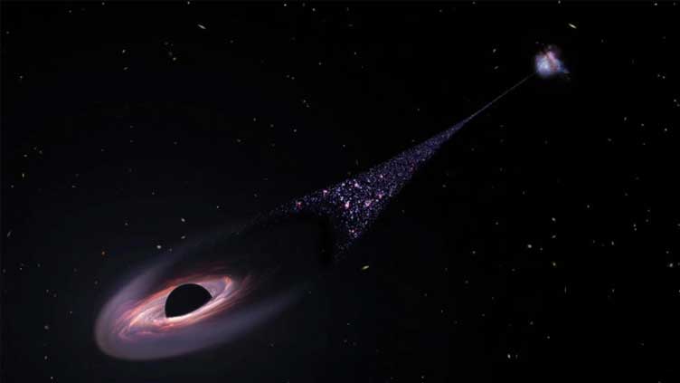 Runaway black hole tears through space, creating trail of new stars