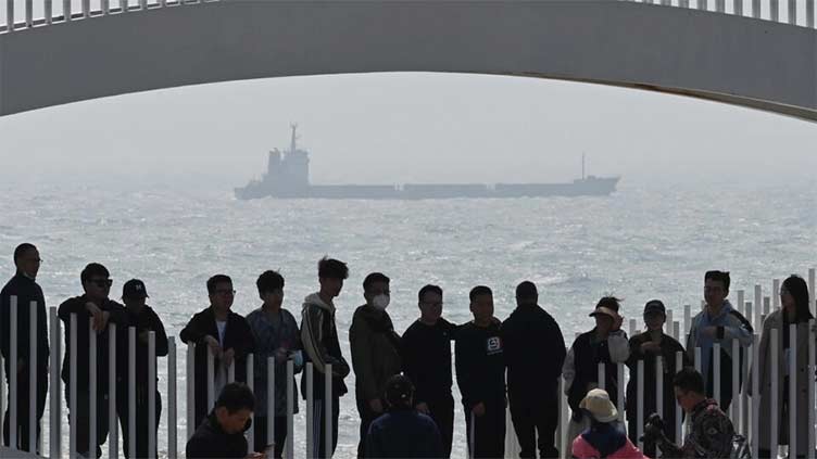 Chinese seaside tourists brush off military drills over Taiwan