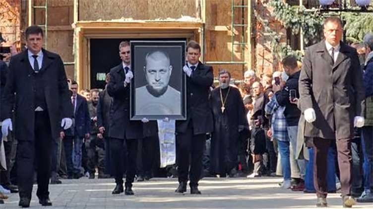Hundreds attend Moscow funeral of pro-war blogger