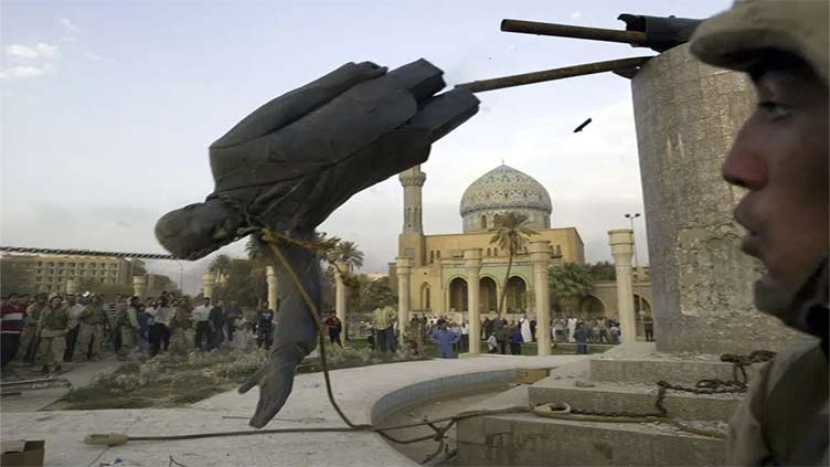 Once everywhere, Saddam's image scrubbed from Baghdad