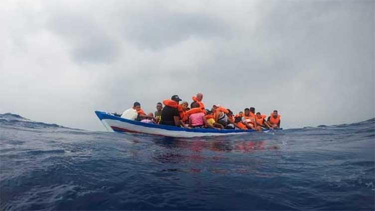 Boat with 400 migrants adrift between Libya and Malta, support service says
