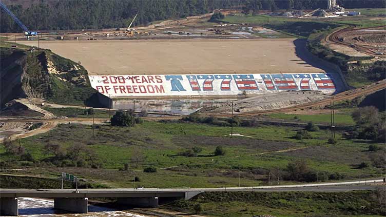 Students' 1976 bicentennial mural on dam being replaced