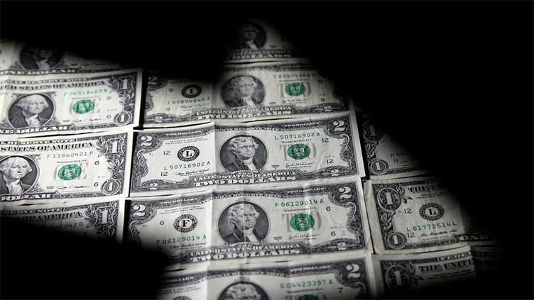 Dollar slides to one-year low as cooling inflation raises Fed pause expectation