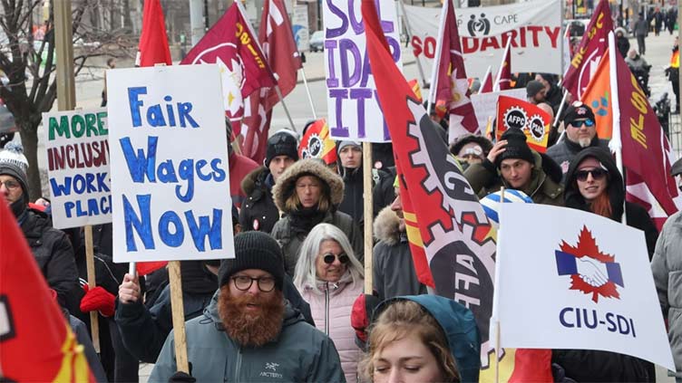 More than 155,000 Canadian federal workers strike to demand higher wages