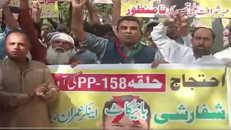 PTI workers reject 'Parachutist' candidate for PP 158