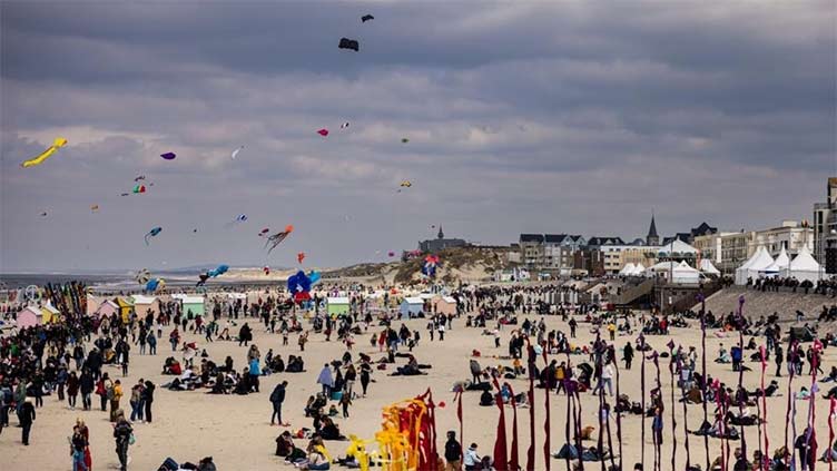 Four badly hurt after car hits crowd at French kite festival