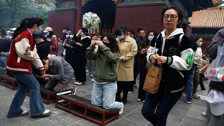 Jobless young Chinese seek solace in temples, tale of failed scholar