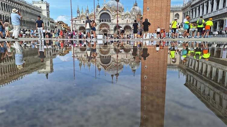 Venetians plead 'please don't come' as tourists jam city