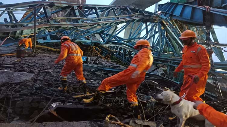 16 workers killed in the collapse of a crane being used to build a bridge in India