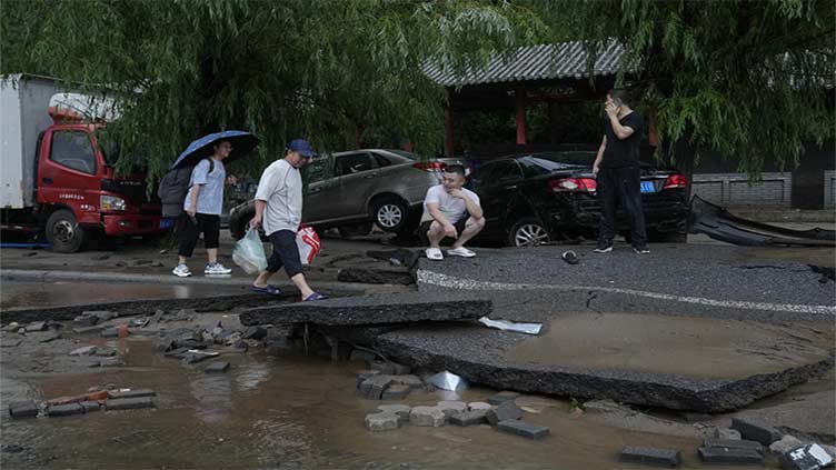 11 dead and 27 missing in flooding around Beijing after days of rain, Chinese state media report