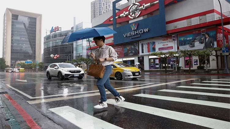 In Taiwan, Typhoon Khanun shuts markets, grounds flights