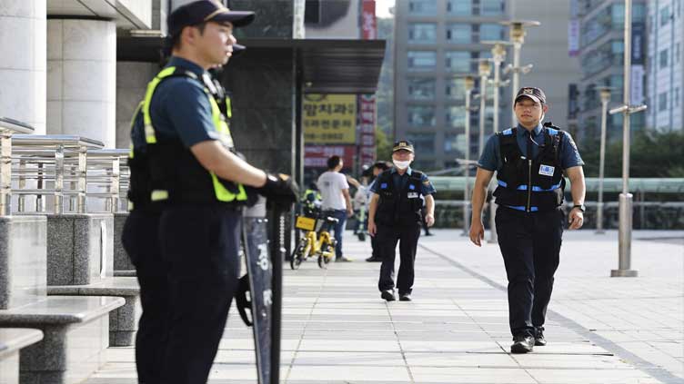 South Korea detains suspect in high school teacher's stabbing a day after separate attack wounded 14