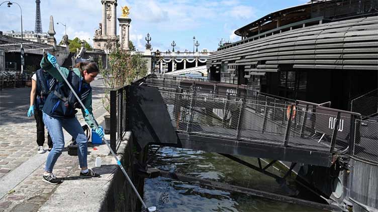 Pre-Olympics women's swimming event postponed as storms dirty Seine river