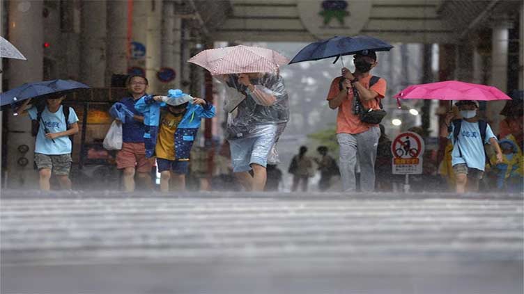 Typhoon Khanun lashes southern Japan, north braces for another storm
