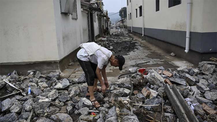 Dozens dead, several missing after record Beijing rains flood suburbs